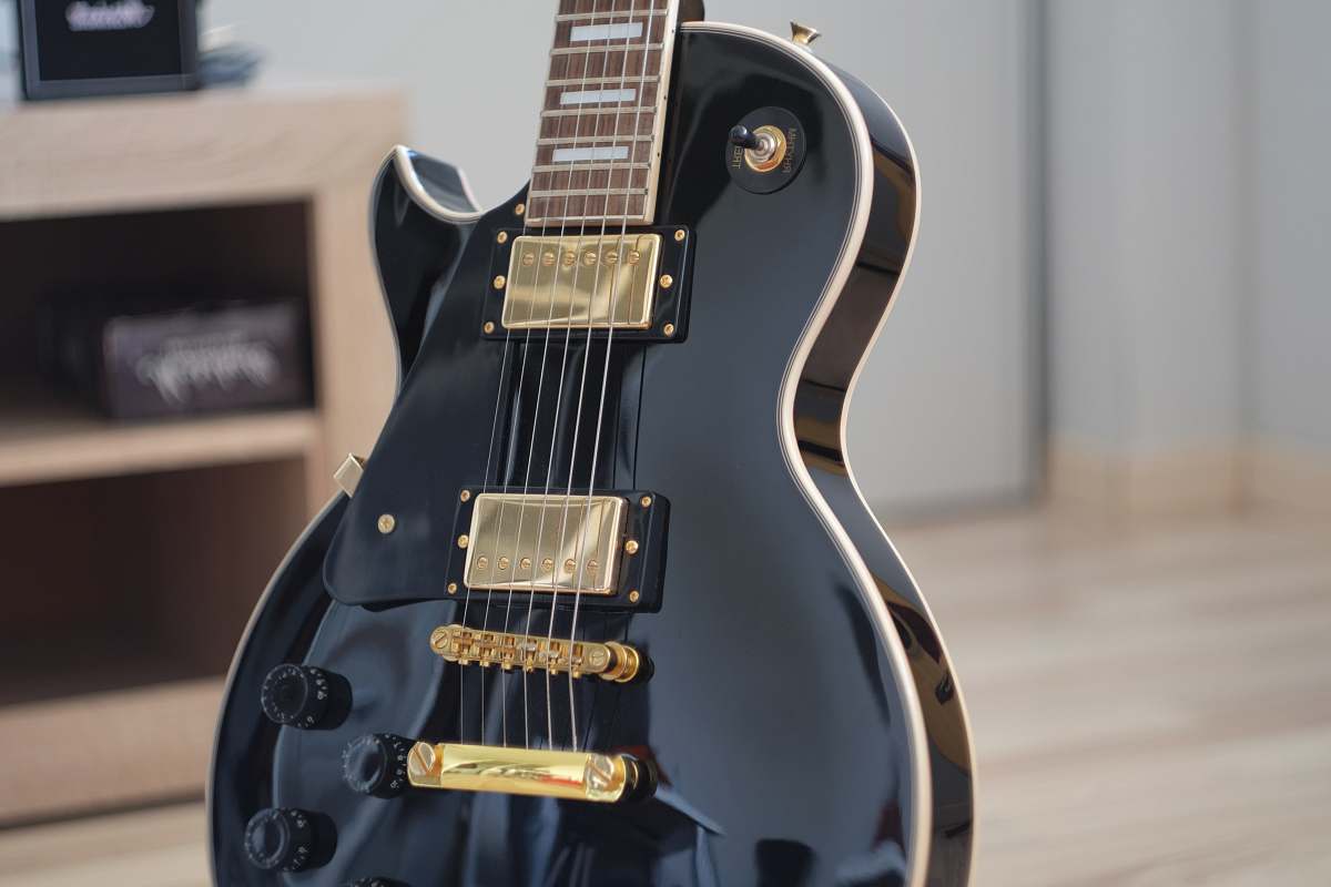 electric guitar macro shot photo of black electric guitar guitar